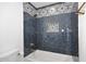 Stylish bathroom with herringbone tile shower and decorative accents at 7904 E Pepper Tree Ln, Scottsdale, AZ 85250