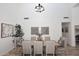 Spacious dining area, featuring a farmhouse table and chandelier at 7904 E Pepper Tree Ln, Scottsdale, AZ 85250