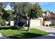 Cute stucco home with a two car garage and manicured lawn at 7904 E Pepper Tree Ln, Scottsdale, AZ 85250