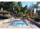 Relax in the community hot tub, surrounded by lush landscaping at 7904 E Pepper Tree Ln, Scottsdale, AZ 85250