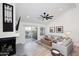 Light and airy living room with a fireplace and access to a patio at 7904 E Pepper Tree Ln, Scottsdale, AZ 85250