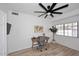 Home office featuring a wooden desk, globe, and world map art at 7904 E Pepper Tree Ln, Scottsdale, AZ 85250