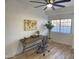 Home office with wood desk and large window at 7904 E Pepper Tree Ln, Scottsdale, AZ 85250