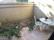 Small patio with table and chairs at 7904 E Pepper Tree Ln, Scottsdale, AZ 85250