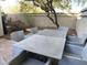 Relaxing patio space with table and chairs, ideal for outdoor entertaining at 7904 E Pepper Tree Ln, Scottsdale, AZ 85250