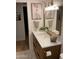 Modern bathroom with updated vanity, gold fixtures, and mosaic tile floor at 7950 E Starlight Way # 142, Scottsdale, AZ 85250