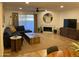 Bright living room with sectional sofa, fireplace, and large TV at 7950 E Starlight Way # 142, Scottsdale, AZ 85250