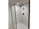 Walk-in shower with marble tile and a frameless glass enclosure at 7950 E Starlight Way # 142, Scottsdale, AZ 85250