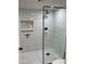 Large walk-in shower with marble tile and a frameless glass enclosure at 7950 E Starlight Way # 142, Scottsdale, AZ 85250