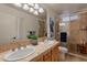 Elegant bathroom with double sinks and a large shower at 8119 E San Miguel Ave, Scottsdale, AZ 85250