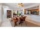 Dining area with a wood table, bench seating, and access to the backyard at 8119 E San Miguel Ave, Scottsdale, AZ 85250