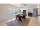 Dining area with a wooden table and chairs, and view of backyard pool at 8119 E San Miguel Ave, Scottsdale, AZ 85250