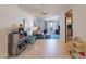 Bright hallway with tile flooring, offering views into living and kitchen areas at 8119 E San Miguel Ave, Scottsdale, AZ 85250