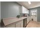 Laundry room with counter space, cabinets and mini fridge at 8119 E San Miguel Ave, Scottsdale, AZ 85250