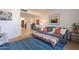 Secondary living area with gray couch, blue rug, and decorative pillows at 8119 E San Miguel Ave, Scottsdale, AZ 85250