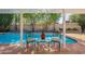 Relaxing poolside seating area with a glass-top table at 8119 E San Miguel Ave, Scottsdale, AZ 85250