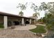 Landscaped backyard with patio and artificial turf at 831 E Spanish Moss Ln, Phoenix, AZ 85022