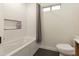 Clean bathroom with a bathtub and shower alcove at 831 E Spanish Moss Ln, Phoenix, AZ 85022