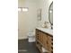 Double vanity bathroom with modern updates and dark tile floors at 831 E Spanish Moss Ln, Phoenix, AZ 85022