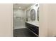 Bathroom with a double vanity, walk-in shower, and stylish mirrors at 831 E Spanish Moss Ln, Phoenix, AZ 85022