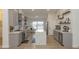 Modern kitchen with gray cabinets, white quartz countertops, and large island at 831 E Spanish Moss Ln, Phoenix, AZ 85022