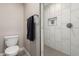 Clean bathroom with toilet and walk-in shower at 8431 E Stella Ln, Scottsdale, AZ 85250