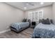 Bedroom with two twin beds and a desk at 8431 E Stella Ln, Scottsdale, AZ 85250