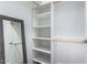 Large walk-in closet with ample shelving and hanging space at 8431 E Stella Ln, Scottsdale, AZ 85250