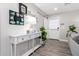 Bright and airy entryway with console table and farmhouse decor at 8431 E Stella Ln, Scottsdale, AZ 85250