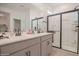 Modern bathroom with double vanity and shower at 8637 N 168Th Dr, Waddell, AZ 85355