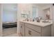 Bathroom with double vanity and bedroom view at 8637 N 168Th Dr, Waddell, AZ 85355