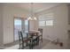 Bright dining area with round table and chairs at 8637 N 168Th Dr, Waddell, AZ 85355