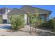 One-story house with a covered porch and drought-tolerant landscaping at 8637 N 168Th Dr, Waddell, AZ 85355