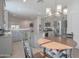 Kitchen with breakfast nook and gray cabinets at 8637 N 168Th Dr, Waddell, AZ 85355