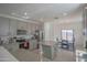 Modern kitchen with gray cabinets and granite countertops at 8637 N 168Th Dr, Waddell, AZ 85355