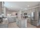 Modern kitchen with stainless steel appliances and island at 8637 N 168Th Dr, Waddell, AZ 85355