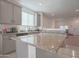 Modern kitchen with granite countertops and gray cabinets at 8637 N 168Th Dr, Waddell, AZ 85355