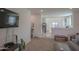 Bright living room with grey sofa and coffee table at 8637 N 168Th Dr, Waddell, AZ 85355