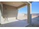 Covered patio with small table, overlooking backyard at 8637 N 168Th Dr, Waddell, AZ 85355