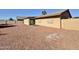 Large backyard with gravel and a small building at 9283 W Rafael Dr, Arizona City, AZ 85123