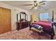 Bright bedroom with a double bed and dresser at 9283 W Rafael Dr, Arizona City, AZ 85123