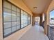 Covered entryway with tiled flooring and iron railings at 9283 W Rafael Dr, Arizona City, AZ 85123