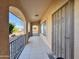 Front entry into home with tiled flooring and wrought iron door at 9283 W Rafael Dr, Arizona City, AZ 85123