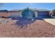 Single-story home with a landscaped front yard and driveway at 9283 W Rafael Dr, Arizona City, AZ 85123