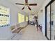 Sunroom with tiled floor and ceiling fan at 9283 W Rafael Dr, Arizona City, AZ 85123