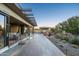 Extended backyard patio with seating area and water features at 9374 E Andora Hills Dr, Scottsdale, AZ 85262