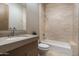 Clean bathroom with a bathtub, single sink vanity, and neutral tile at 9374 E Andora Hills Dr, Scottsdale, AZ 85262