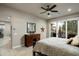 Serene bedroom with dresser and access to a private bathroom at 9374 E Andora Hills Dr, Scottsdale, AZ 85262