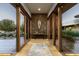 Elegant entryway features a stone accent wall and wood flooring at 9374 E Andora Hills Dr, Scottsdale, AZ 85262