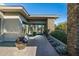 Modern home exterior with stone accents and a walkway at 9374 E Andora Hills Dr, Scottsdale, AZ 85262